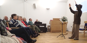 Gillian Cummins of the Iona Community leading singing workshop